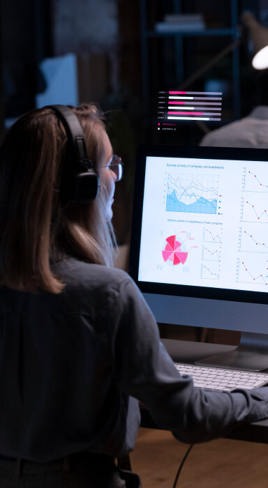 Illustration of a computer screen with data analysis, graphs, charts, documents, and a magnifying glass.