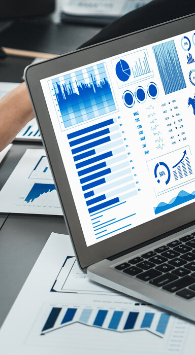 Illustration of two professionals interacting with data visualizations in a virtual environment.