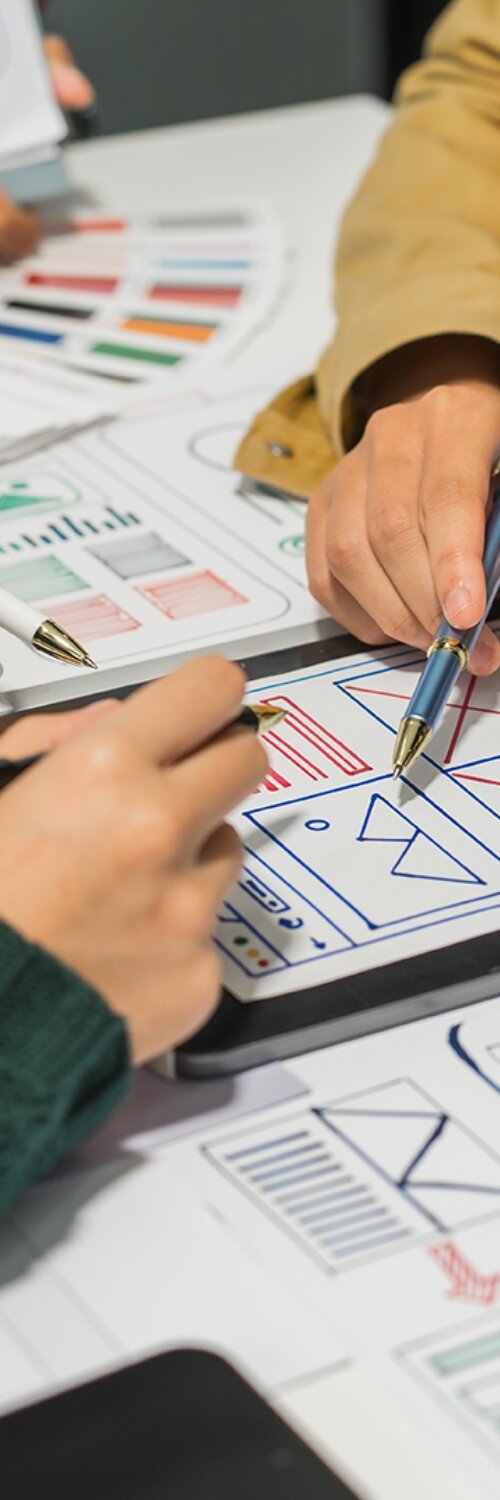 UI/UX Audit services with hands adjusting a user interface on a computer screen. Discover ui ux audit services for refining web and app design elements