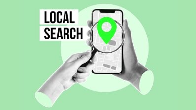Mobile phone with a magnifying glass focusing on a location pin, emphasizing the importance to optimize for local search and Google Business optimization